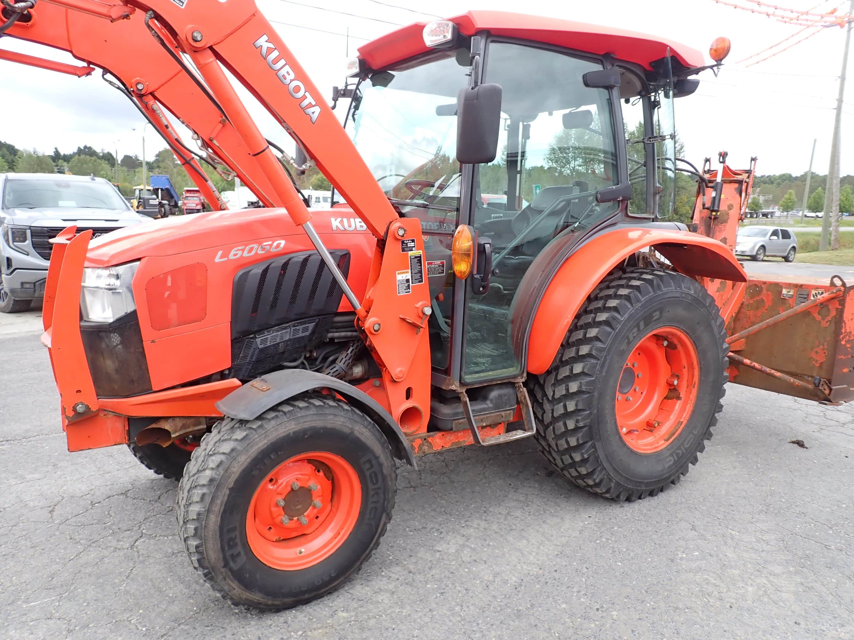 2019 Kubota L6060 Tractor with Pronovost snowblower and Grattex extendable scraper